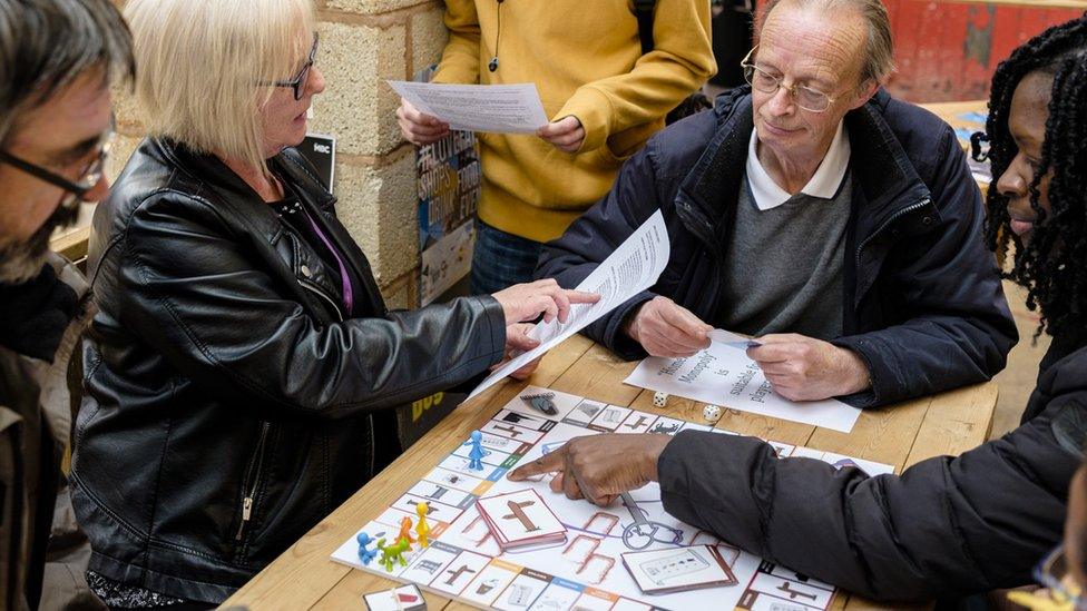 People playing Homelessness Monopoly