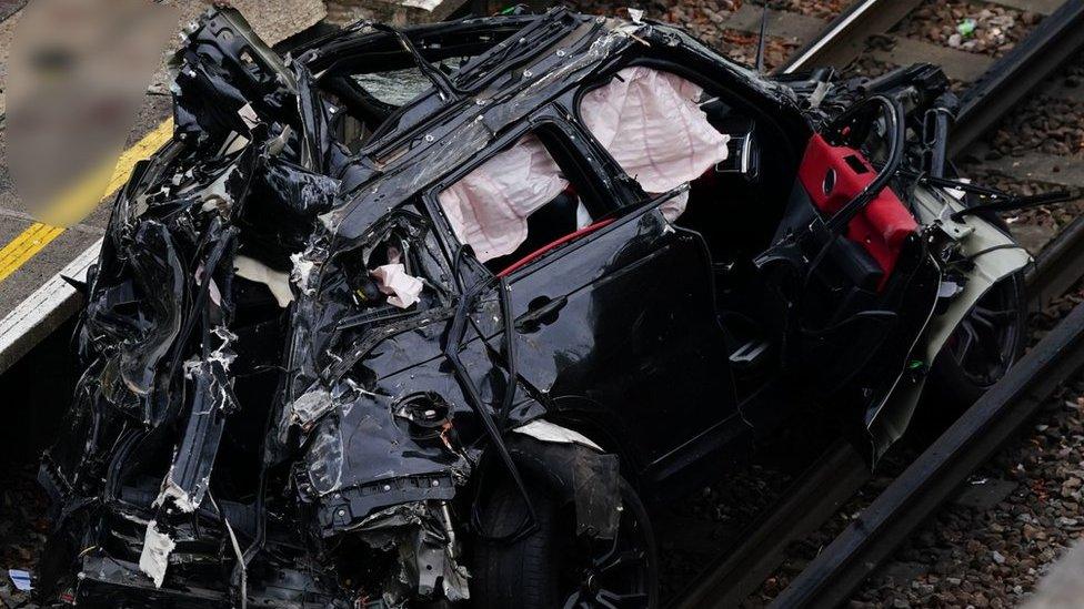 Image showing the damaged Range Rover on the tracks at Park Royal station.