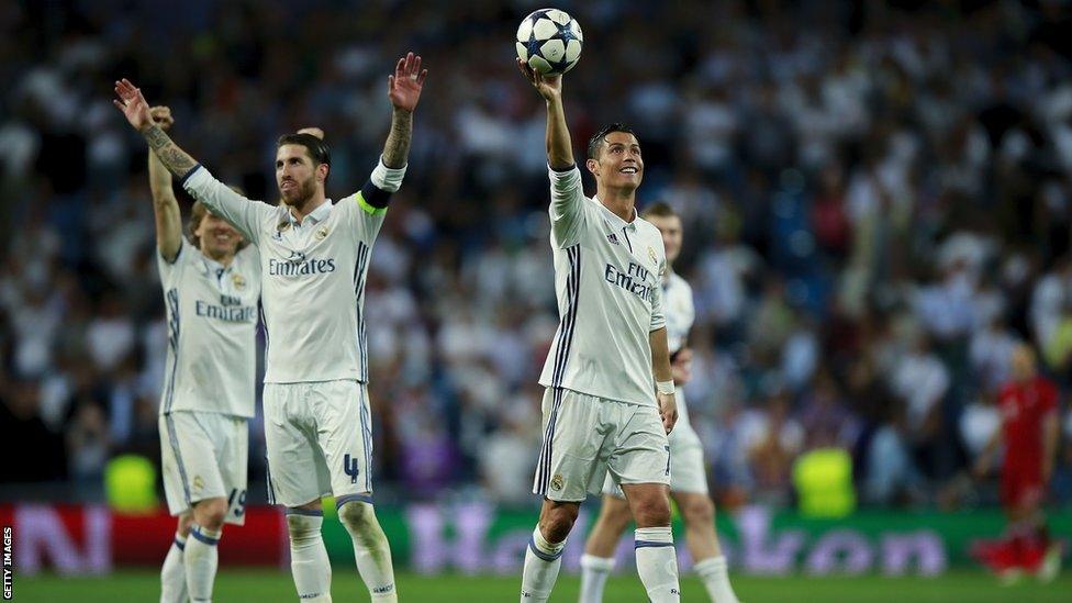 Cristiano Ronaldo shows off the matchball after hitting three figures in the Champions League