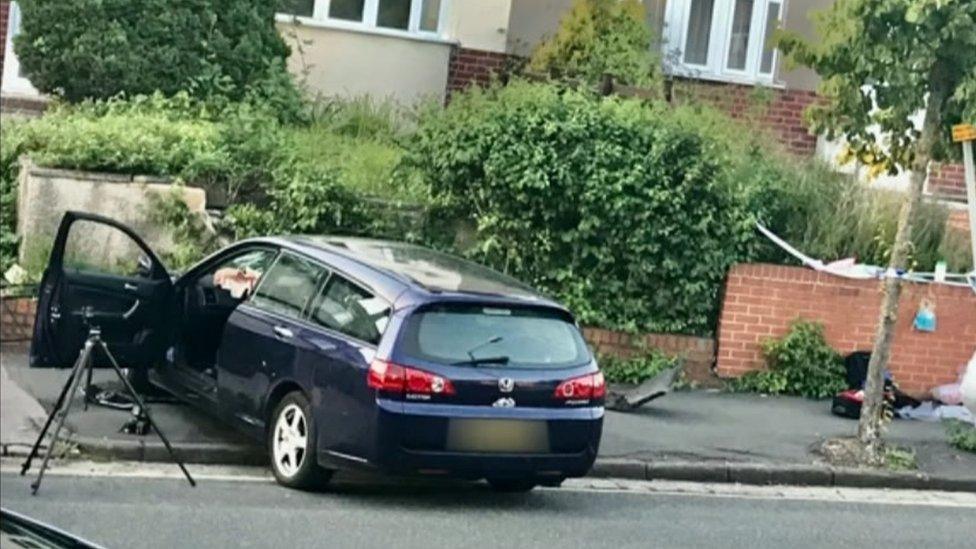 Dark blue Honda Accord, mounted on the pavement on Monks Park Avenue.