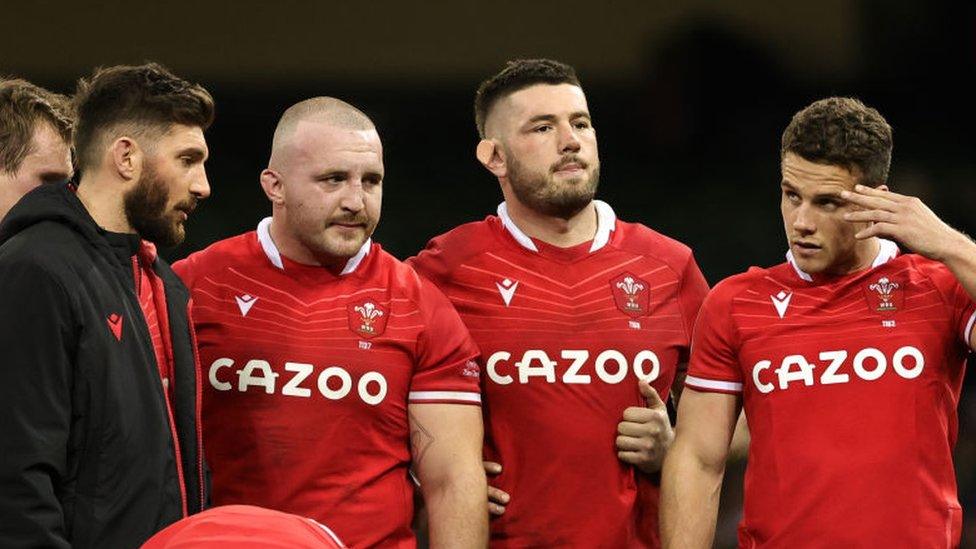 Wales players looking dejected after the match