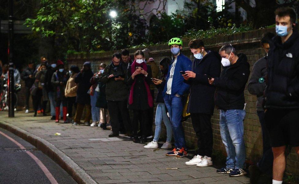 People queuing for a Covid booster dose