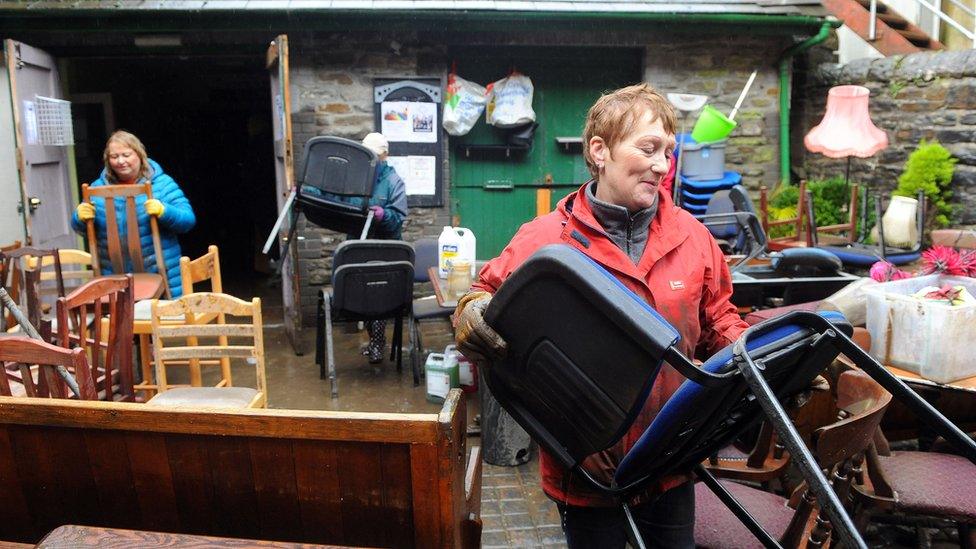 women cleaning up Clwb y Bont