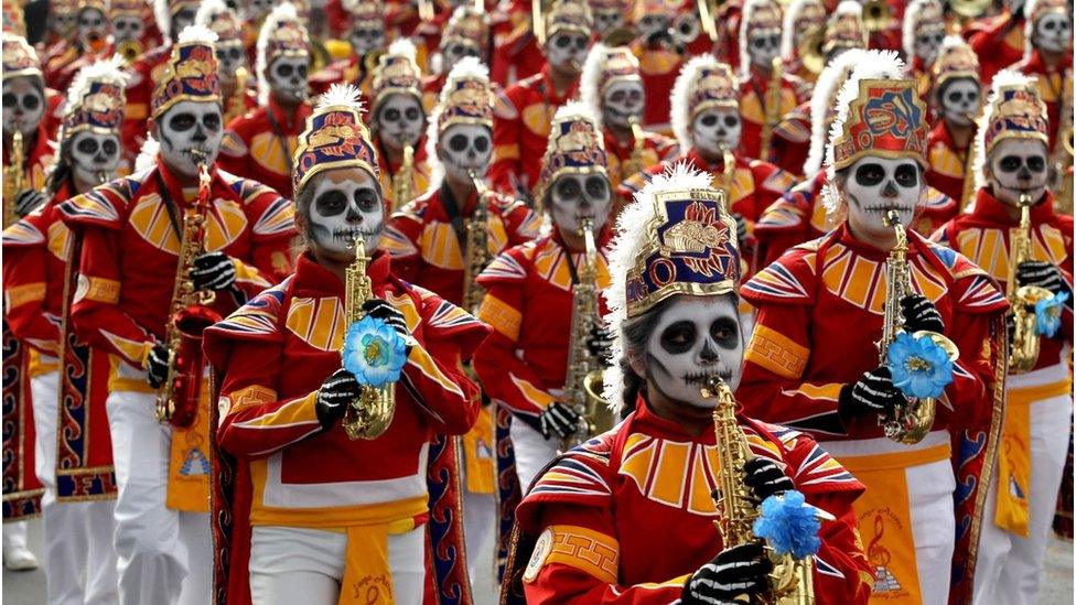 Marching band with instruments marching in parade