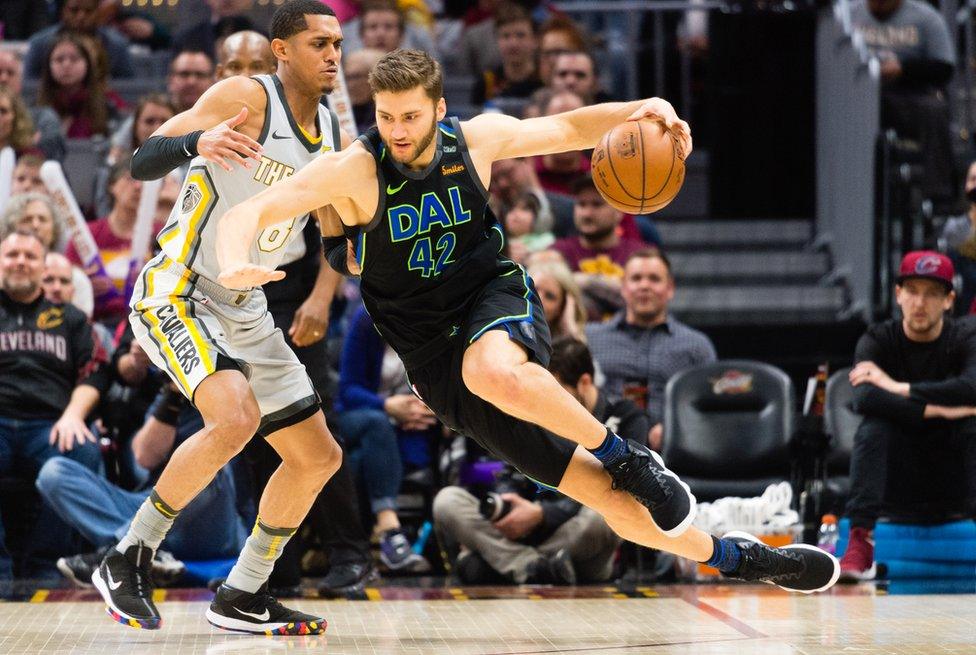 Maximilian Kleber of the Dallas Mavericks trying to get past Jordan Clarkson of the Cleveland Cavaliers