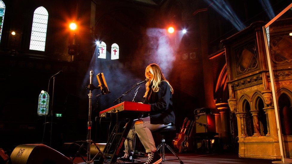 Picture of Grace Davies playing piano