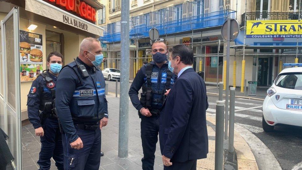 Nice Mayor Christian Estrosi with police at the scene of a knife attack at the Notre-Dame church