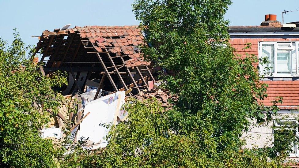 House with roof blown off