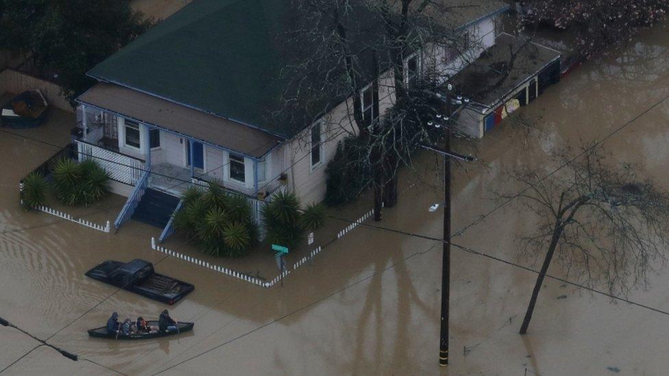 Guerneville residents are forced to travel by canoe through their neighbourhood