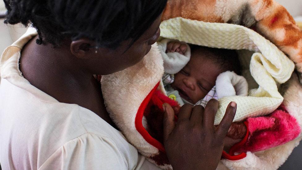 Lucia Kagotha holds her new born baby boy, named 'Obama' in honour of the US President Barack Obama, at the Mbagathi Hospital of Nairobi on July 26, 2015