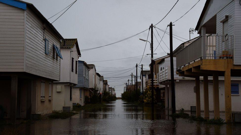 A street is closed by flood waters following heavy rains in Gruissan, southern France on October 23, 2019