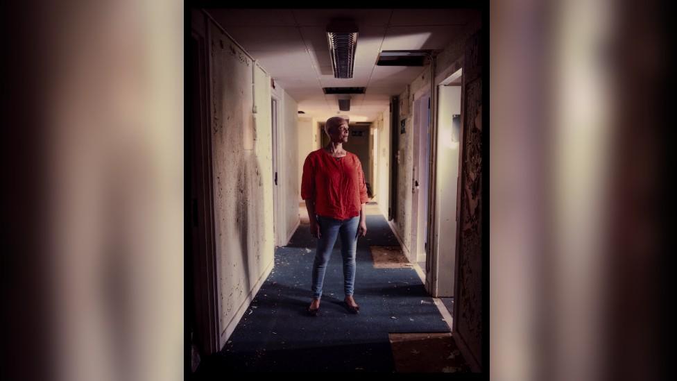 Mandy standing in corridor of HMP Holloway