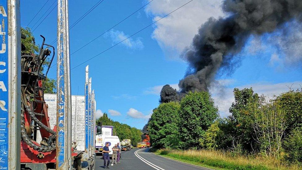 Black smoke billowing from the lorry