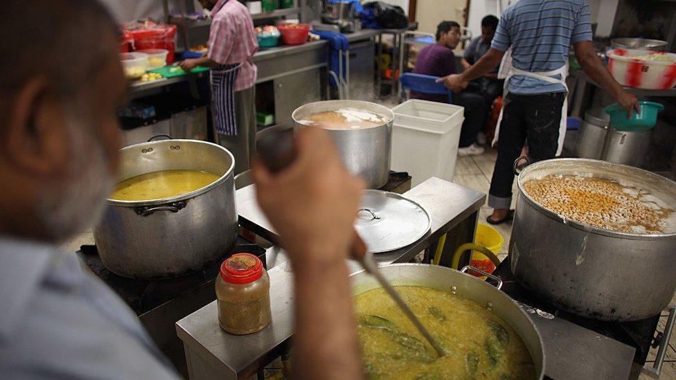 Muslim men prepare food for Iftar, the evening meal during the Muslim holy month of Ramadan at the London Muslim Centre on August 18, 2010 in London, England.