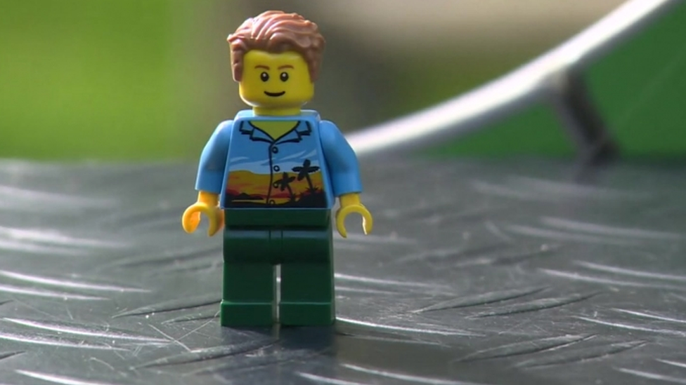 Mini Lego toy in a Hawaiian shirt