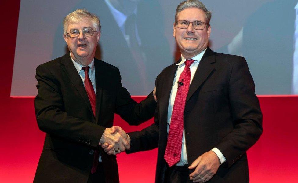 Mark Drakeford and Keir Starmer shake hands, at this year's Welsh Labour conference, in Llandudno