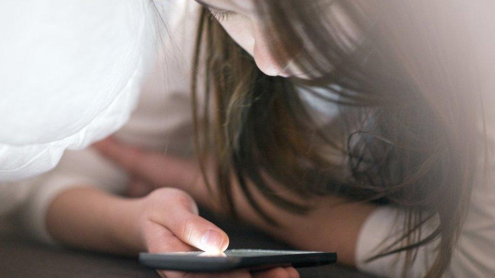 Teenage girl using a smartphone