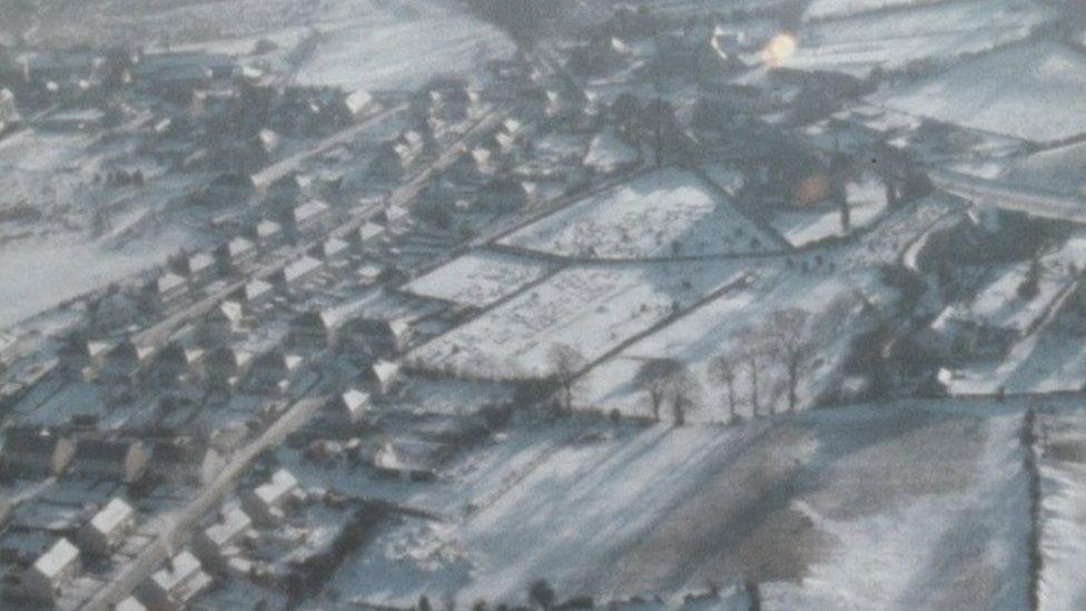 A an aerial shot of the snow