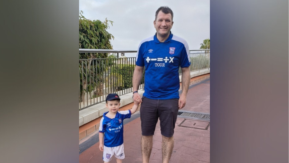 David Moore and one of his sons in their Ipswich Town football kit