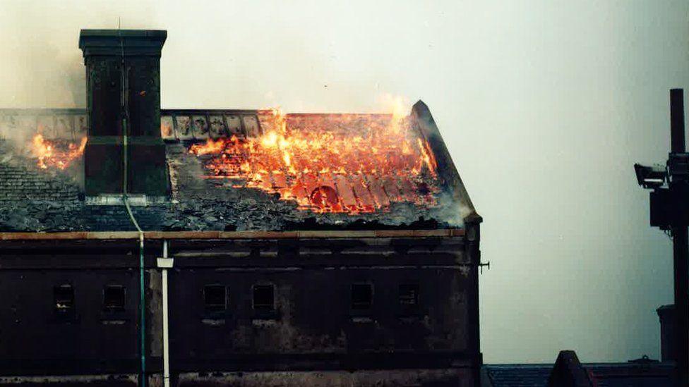 Peterhead prison on fire during the riot in 1987