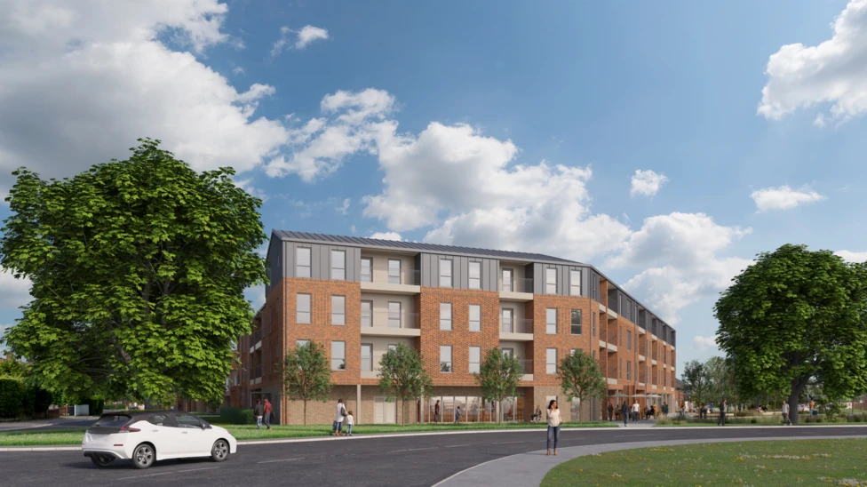 A computer-generated image of a red brick block of flats with grey metal cladding on the top floor. It is four storeys high, has balconys and looks modern. There are large green trees at either side.