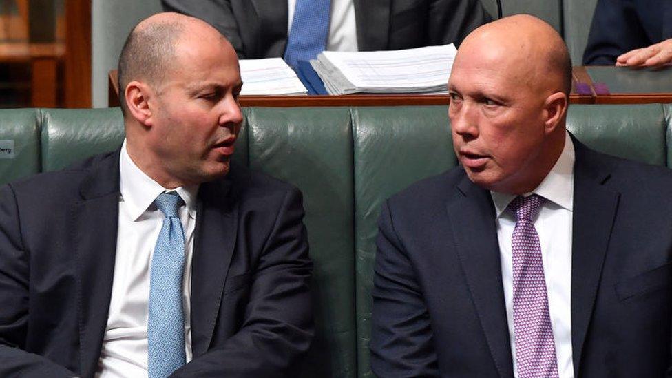 Josh Frydenberg and Petter Dutton sit in Australia's parliament