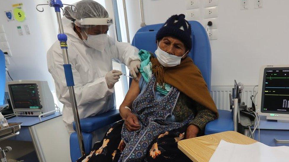 Vaccine being given to woman in Bolivia