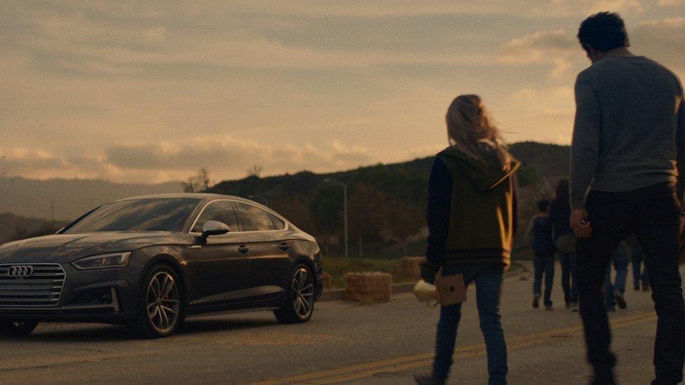 Father and daughter return to the car