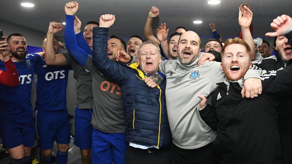 Darvel owner John Gall (centre) celebrates with the players and staff