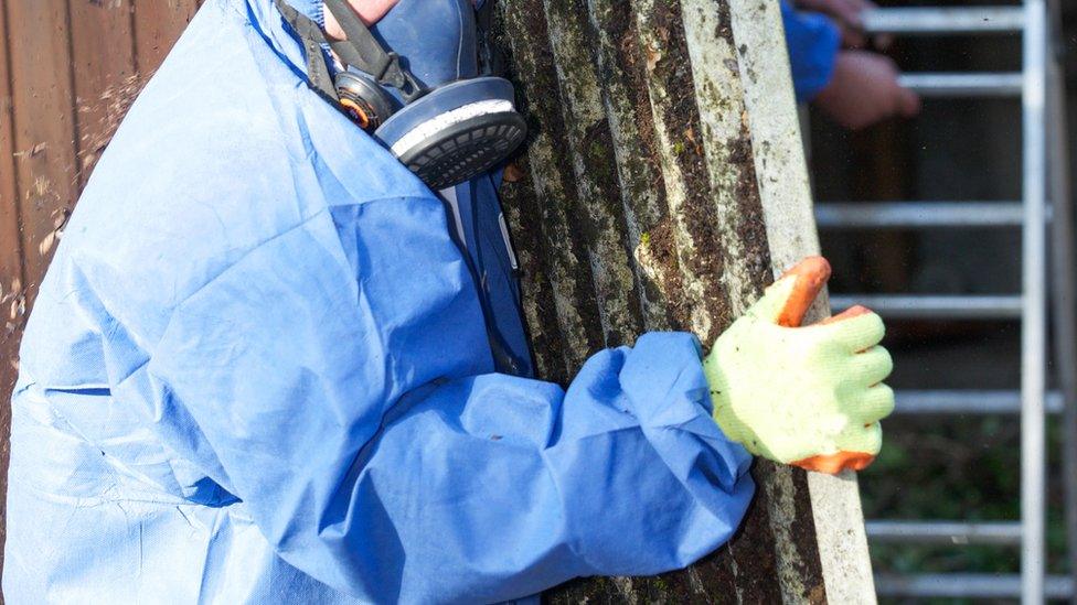 A man removing asbestos