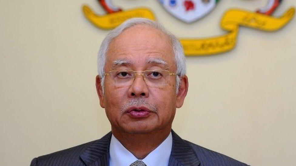 This file picture taken on 28 July 2015 shows Malaysia's Prime Minister Najib Razak addressing a press conference at his office in Putrajaya.