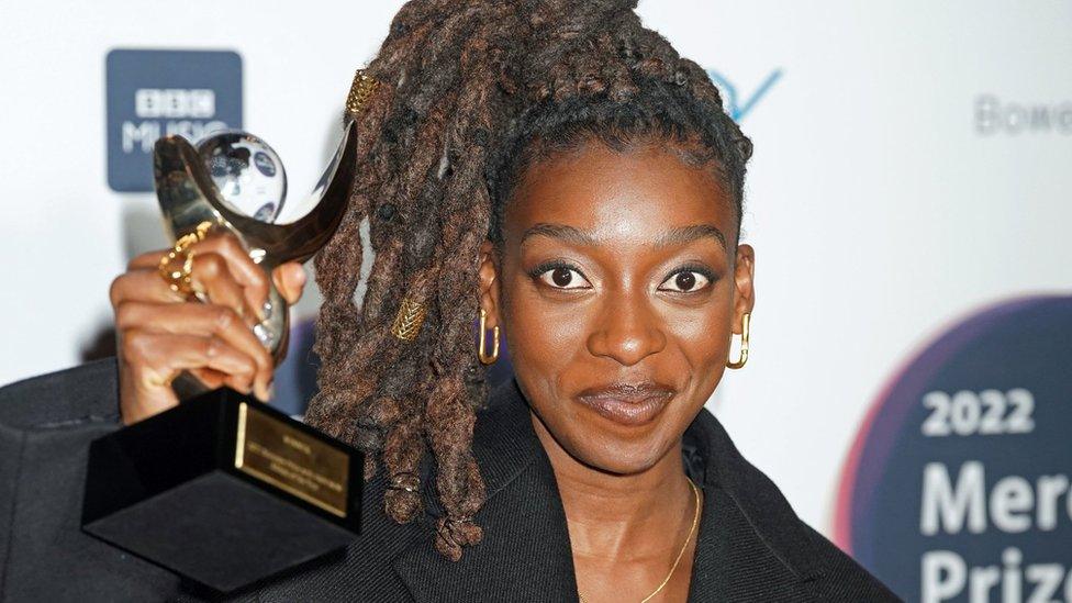 Little Simz holding Mercury award