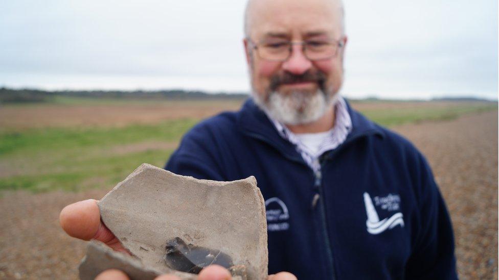 Ben Jenman with pottery and flint