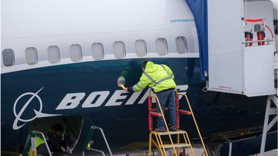 Worker on Boeing aircraft