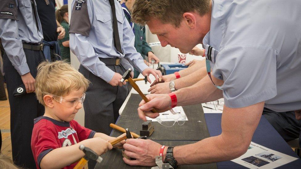 A youngster enjoys a STEM (Science, technology, engineering, and mathematics) activity.