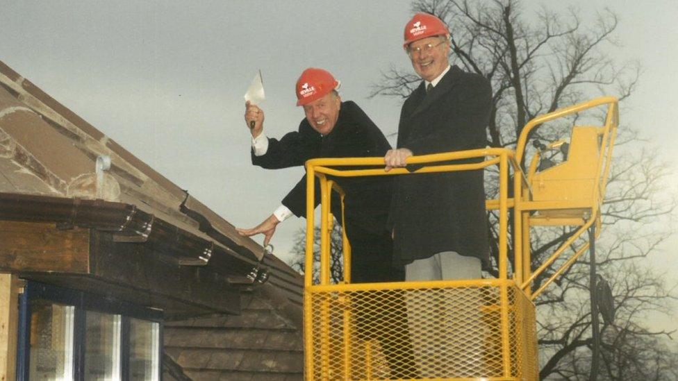 Dennis Keech by a roof