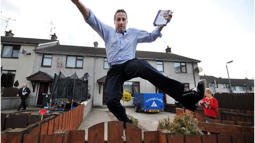 Ian Paisley jumping over a fence