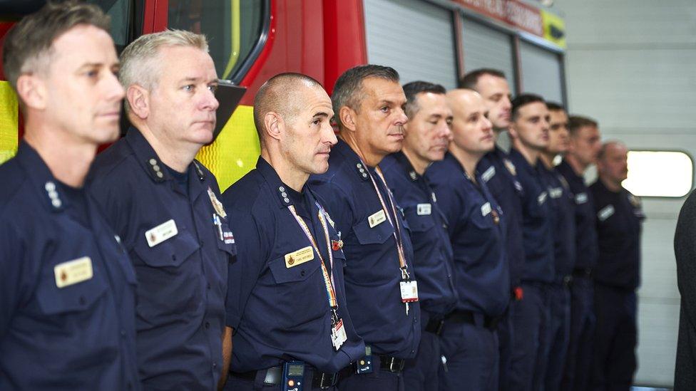 Firefighters at the unveiling of a plaque honouring Norman Nolan