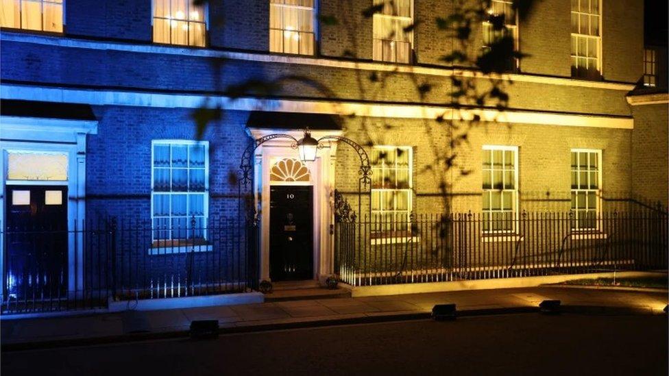 10 Downing Street in London is lit up in yellow and blue to show solidarity with Ukraine