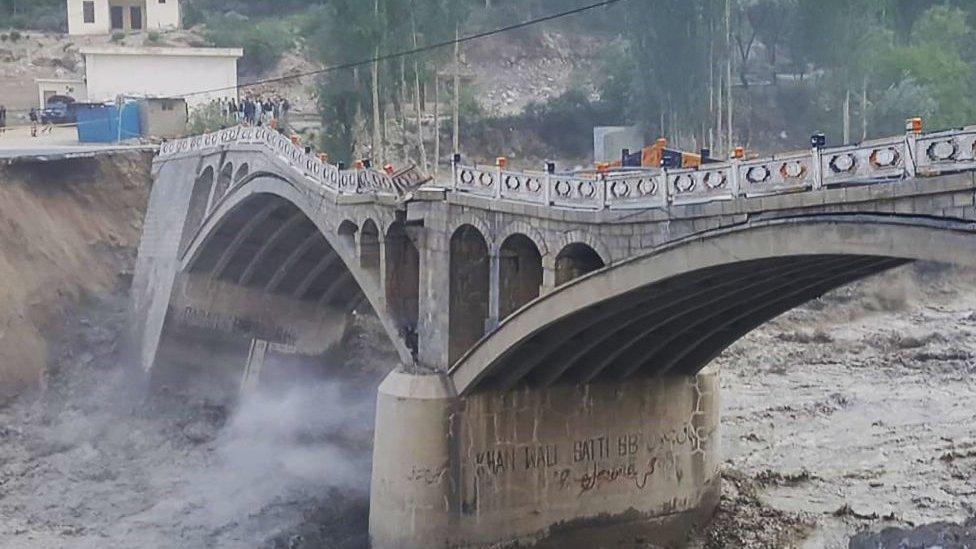 A bridge partially collapsed due to flooding