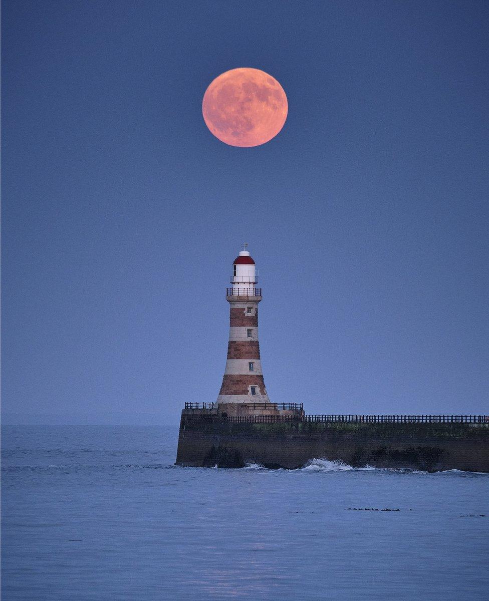 Michael Wake said the Strawberry Moon got brighter and brighter as it rose over Roker Pier in Sunderland