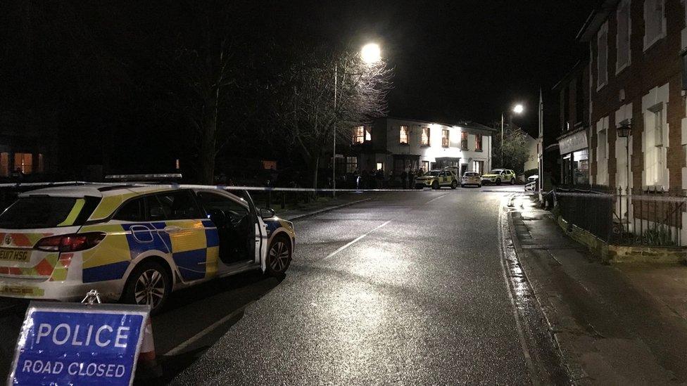 Police cars in front of the Rose and Crown