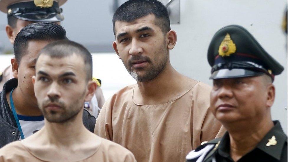 Adem Karadag (L), and Yusufu Mieraili arrive at court in Bangkok, Thailand (16 Feb 2016)