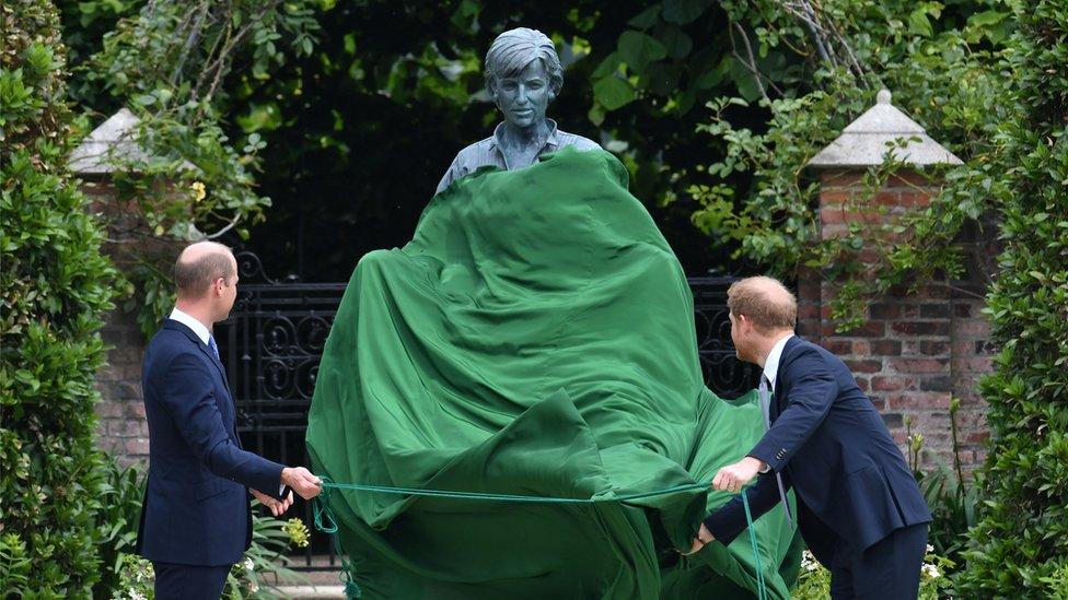 Prince Harry and Prince William next to the statue of Diana