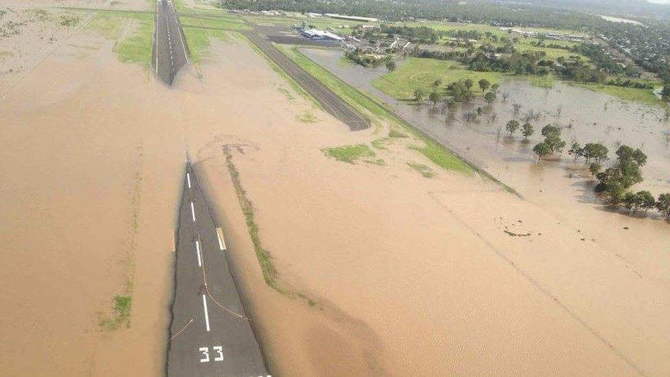 Floods cover a runway at Rockhampton Airport