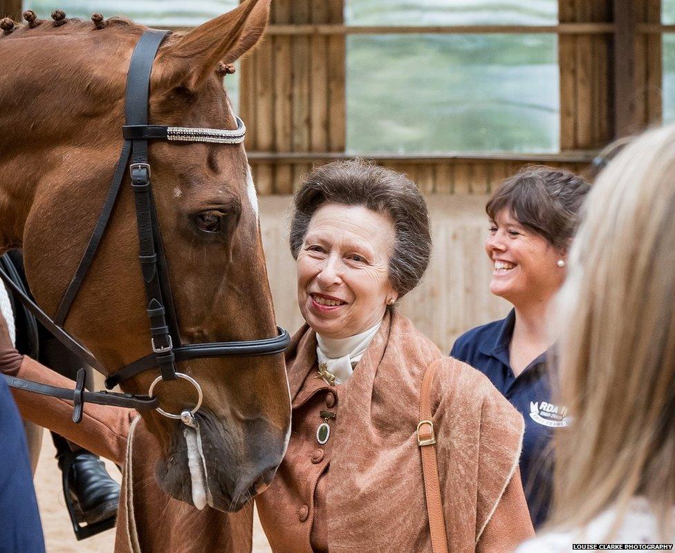 Princess Anne meets a horse at the opening of an RDA training centre