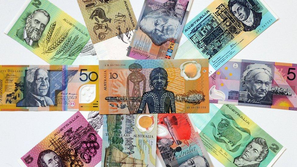 Australian dollar paper and polymer notes form a colourful mosaic