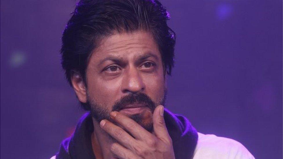 Bollywood superstar Shah Rukh Khan gestures during a press conference on his birthday in Mumbai, India, Monday