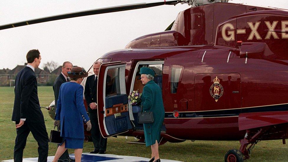 Queen boards a helicopter