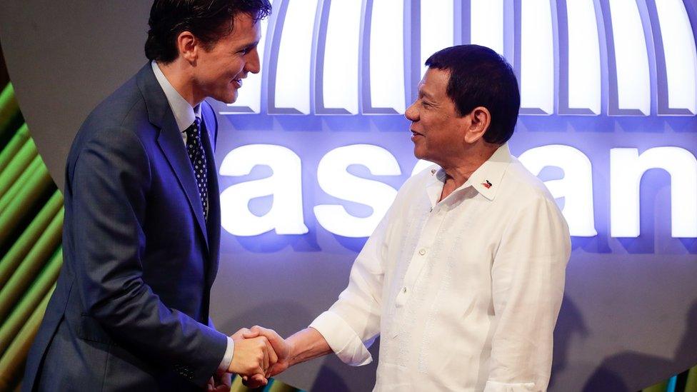 Canada's Prime Minister Justin Trudeau shakes hands with Philippine President Rodrigo Duterte in Manila in November 2017